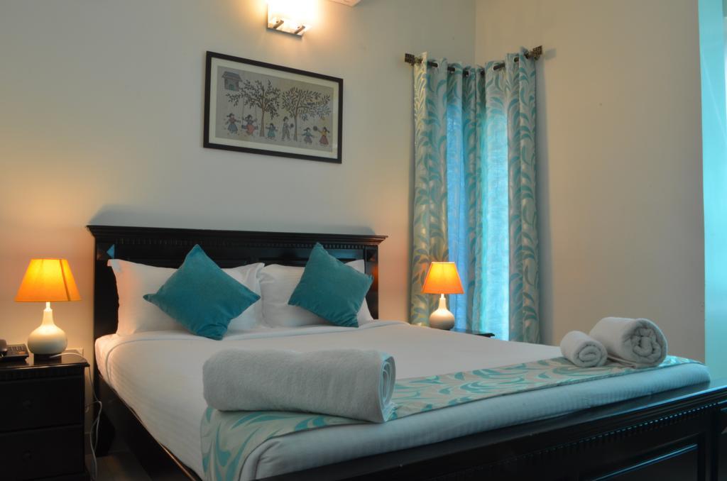 Luxtay Suites Bangalore Quarto foto